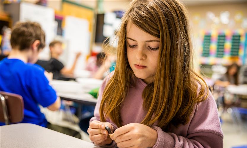 Students create compasses in science class